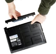 Removing a battery from a laptop. (Click for larger image.)