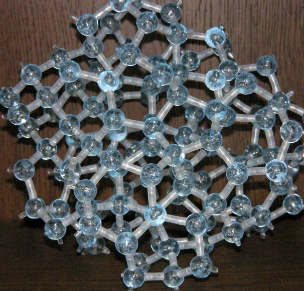 a glass-like amorphous solid which is free of any crystalline structure,