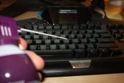 Taking a can of compressed air to a keyboard.