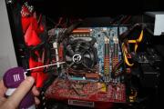 Compressed air can clean out PC fans--just make sure not to blow dust back into the PC.