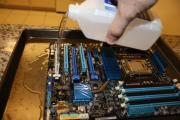 Giving the motherboard an alcohol bath.