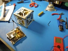 Assembly of PhoneSat 1.0. Photo courtesy of NASA Ames Research Center, 2011.
